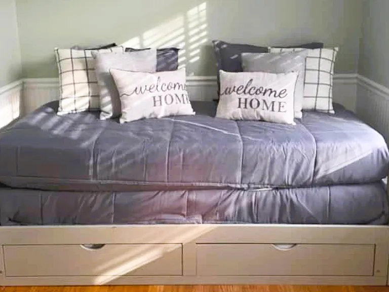 Relax on this cozy sofa bed with soft cushions.