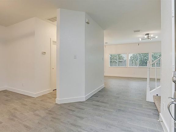 Step inside to discover beautiful tile floors and fresh paint, upgraded light fixtures, and tons of fantastic natural light.