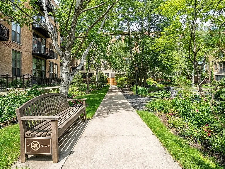 Enjoy the coveted tranquil Block Y courtyard with walking path, benches and serene koi pond