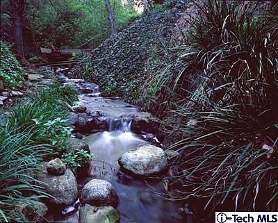 Waterfalls and cascades along the year-round private stream in the backyard