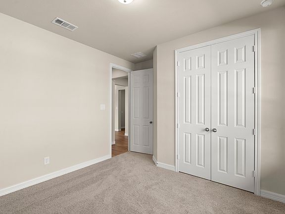 An additional view of the fifth bedroom and closet