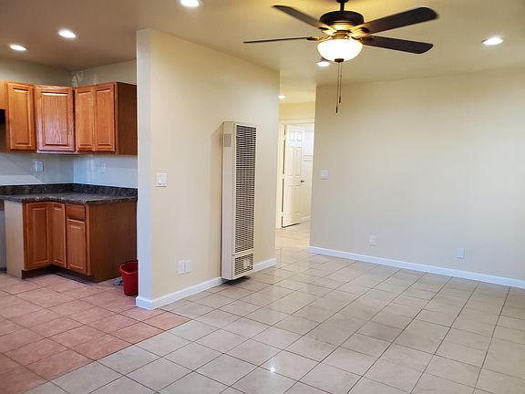 NEW CABINETS; NEW CEILING FAN; PLENTY OF CAN LIGHTS FOR A BRIGHT LIVING, DINING AND KITCHEN OPEN SPACE