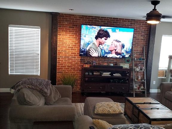 Living area with brick wall decor