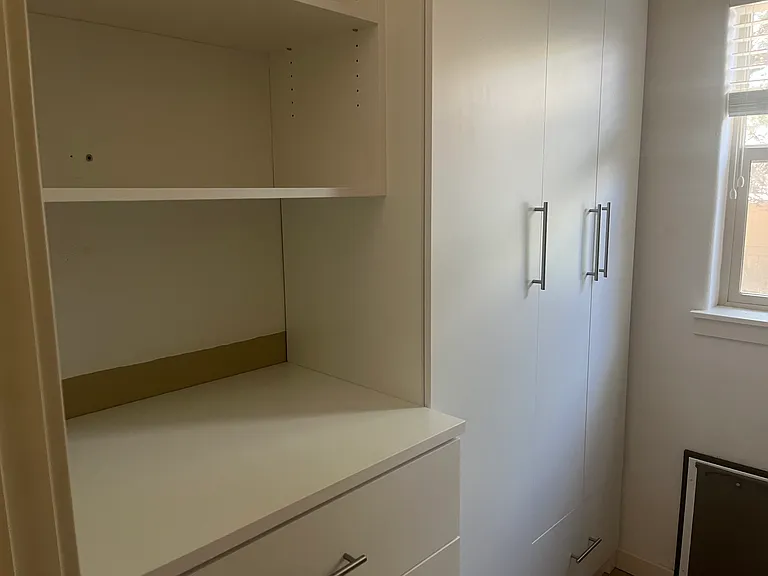 laundry room with california closets for lots of storage