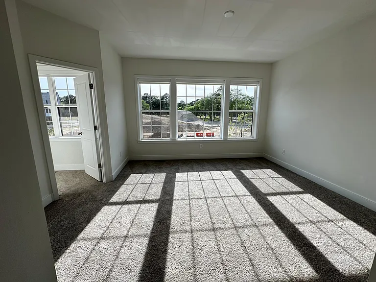 Sun-drenched master bedroom with 2 walk-in closets