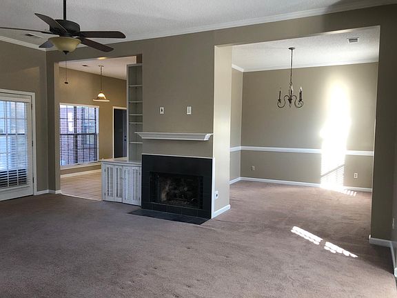 Den looking into Dining Room on Right and looking into Kitchen on left