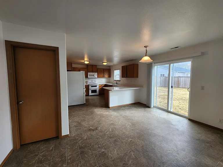Big, open kitchen & dining with new quartz counters & downstairs powder room.