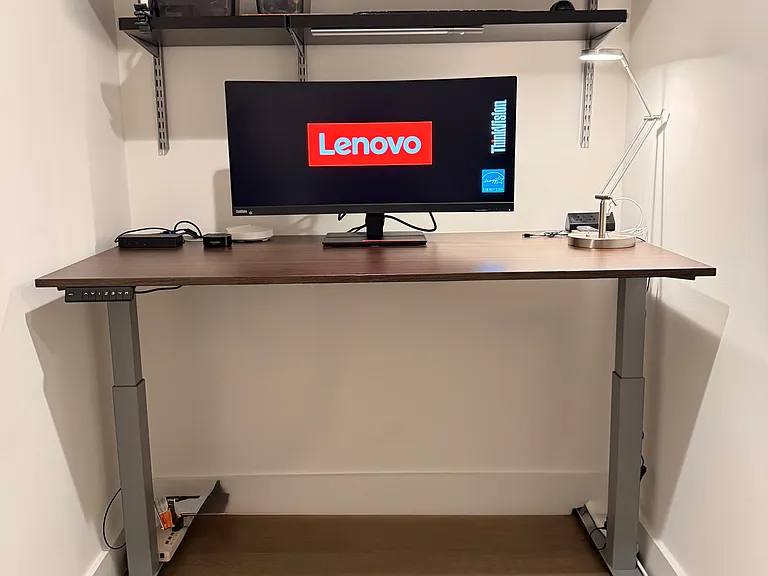Standing desk with the ability to program different settings. 
Anti fatigue pad available for standing feature.