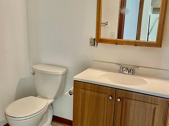 bathroom with tub/shower combo and large storage closet