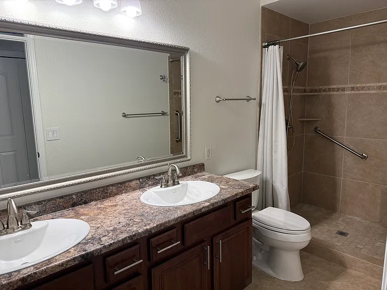 Bathroom with walk-in shower.