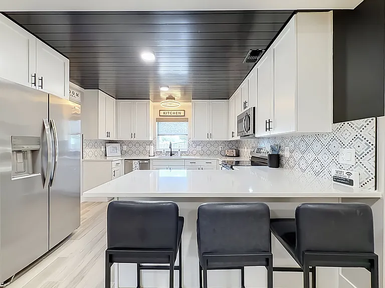 Full sized kitchen and appliances. Room for three at the counter to eat, read a newspaper or watch the chef, while you enjoy a refreshing beverage!