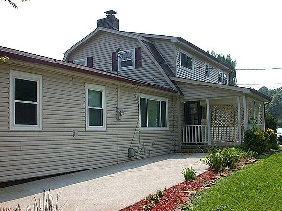 Great covered porch and patio for grilling, entertaining, an