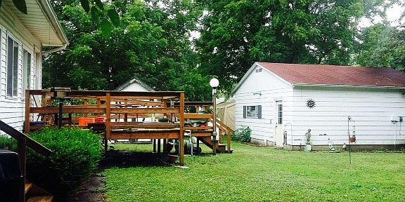 large yard, deck and garage
