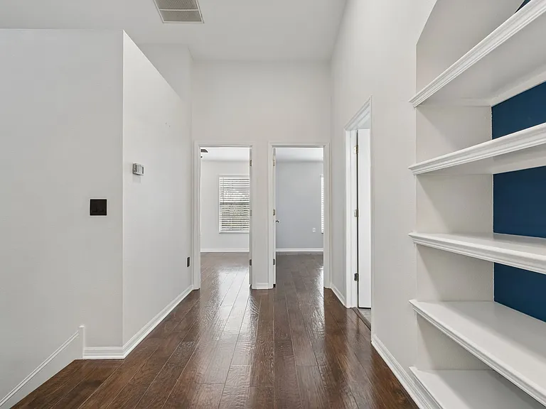 Hallway with customed built-in shelves