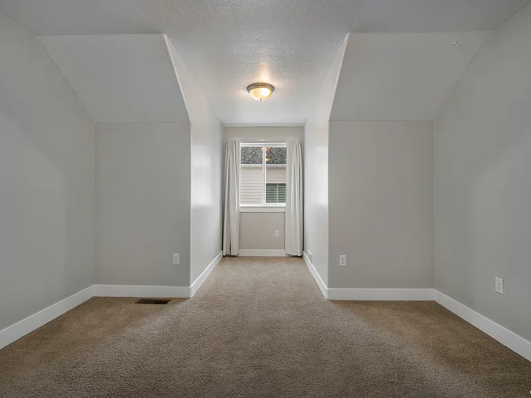 Upstairs bedroom number 3 with additional space and walk in closet.