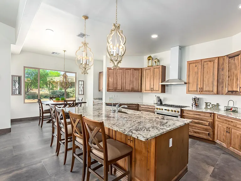 LARGE OPEN BRIGHT KITCHEN, LOTS OF WORK SPACE. THREE OVENS PLUS THE MICROWAVE DRAWER.