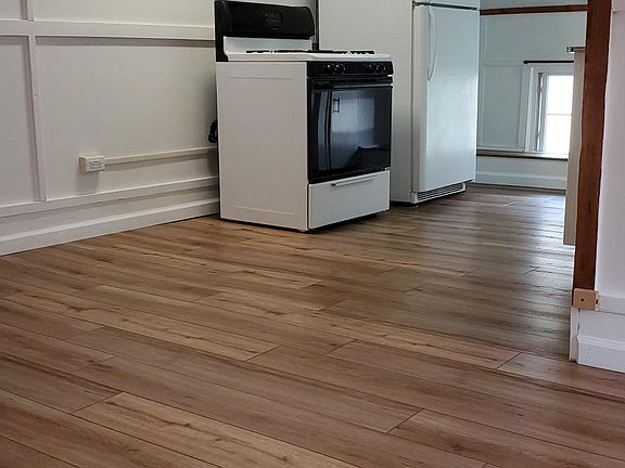 View of Back Entry door as seen from the carpeted Bedroom