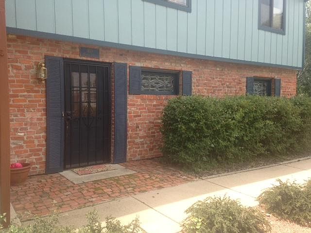 Attached garage with entrance and gated outside entrance