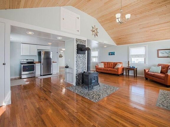 Dining area to kit and liv rm, beautiful River Rock additions and Wood Cathedral Ceilings!