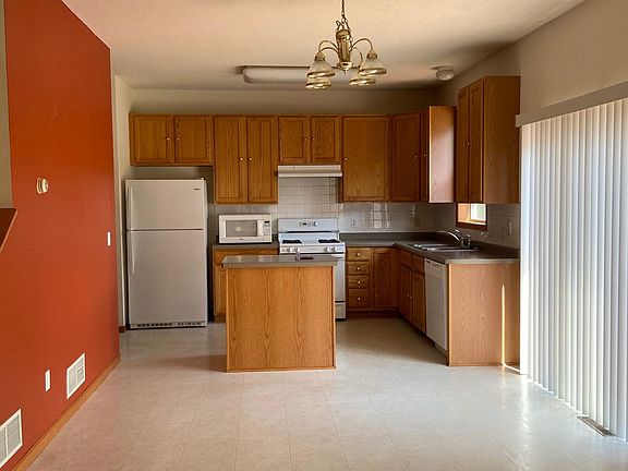 Kitchen and dining leading to outside deck.