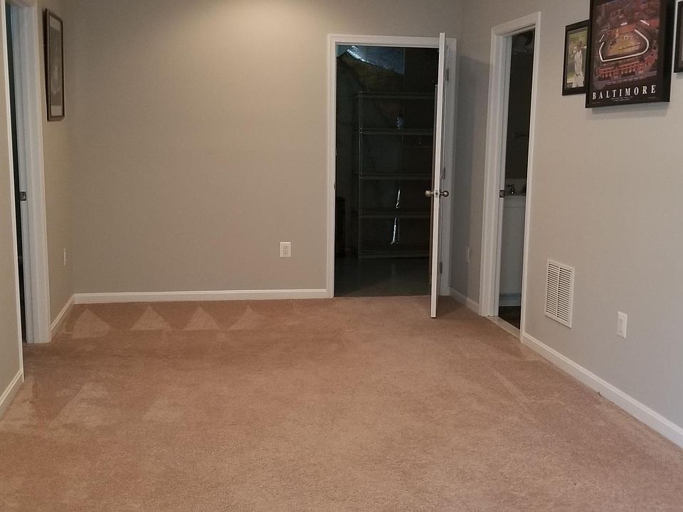 Looking from living room into dining room. Bedroom to the left. Kitchen forward. Bathroom to the right.