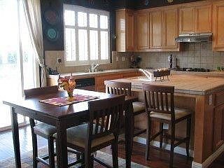 Custom tile kitchen with hardwood floors