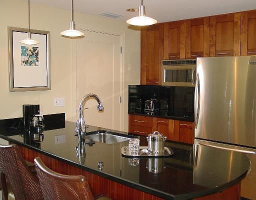 Stainless steel appliances and granite