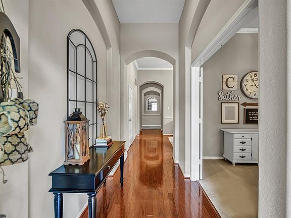 The entry hall gives you the first look at decorative archways that are found throughout the home.