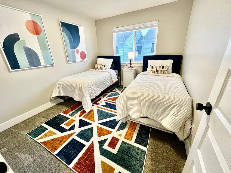 One of the twin beds has a trundle so you can sleep 3.