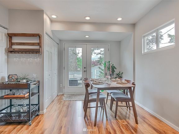 French doors off dining room lead to lovely fenced yard