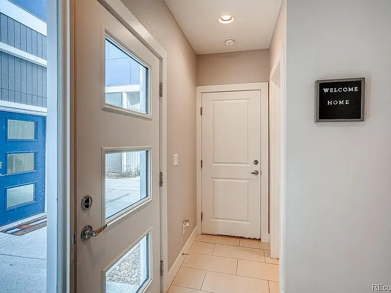 Front door & entry way; half bath on this floor, as well as access to the 2 car garage