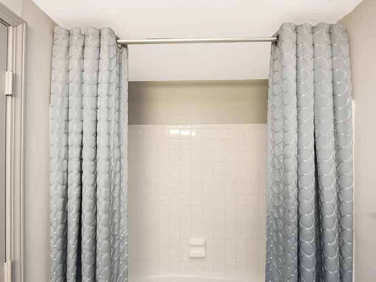 Bathtub with tile backsplash