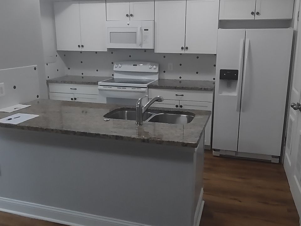 Kitchen comes with Fridge, Dishwasher, Washer and Dryer, Cooktop Oven and Microwave