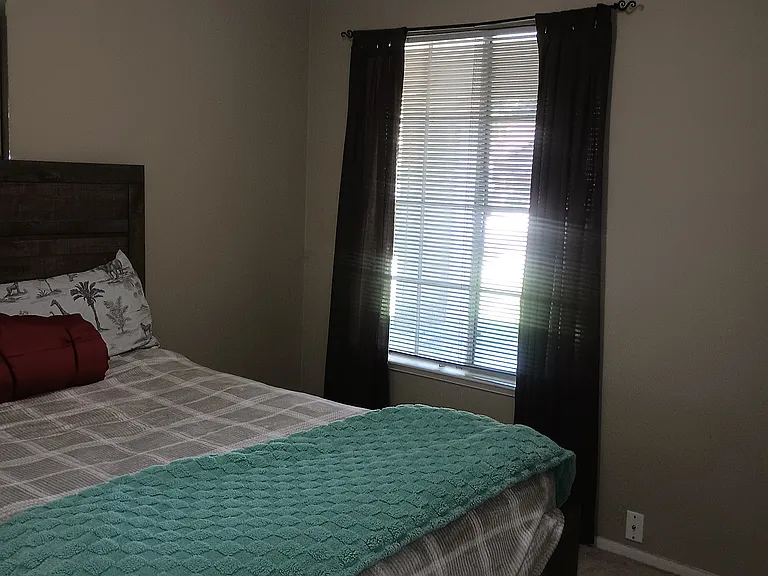 Third bedroom with ceiling fan