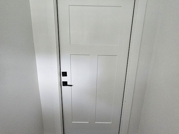 Front door to first floor unit 4834. Stairs to upstairs unit are to the left.