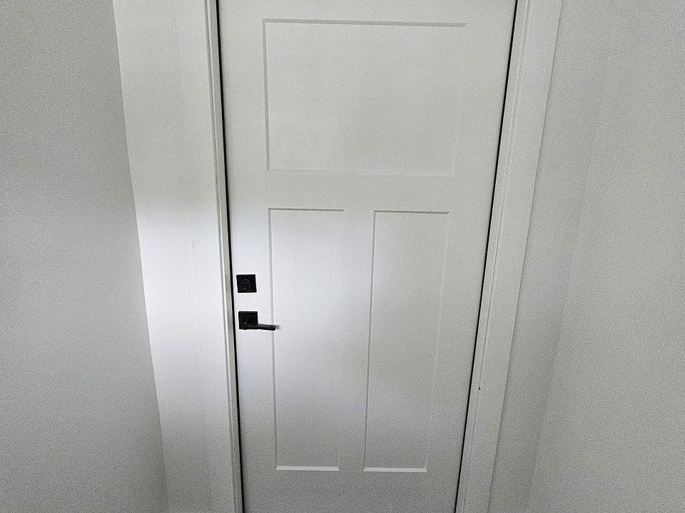 Front door to first floor unit 4834. Stairs to upstairs unit are to the left.