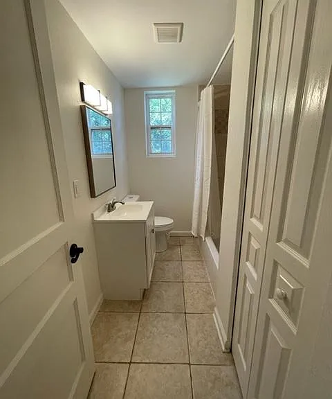 Entrance to bathroom. Bath has laundry closet.