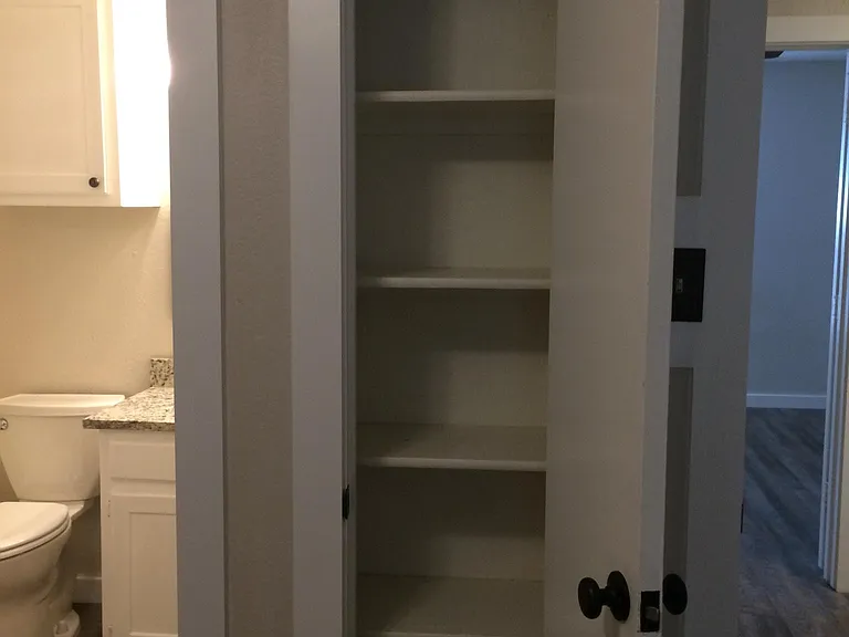 Storage closet in bedroom #1. Great for shoes, books, etc. in addition to walk in closet!