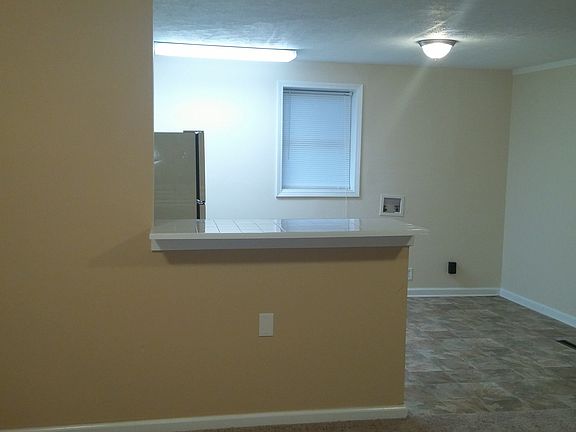 Entry view of living room to open kitchen