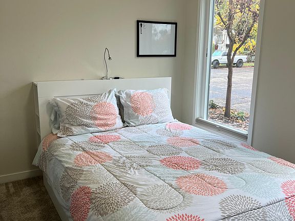 Guest bedroom with queen bed on first floor.