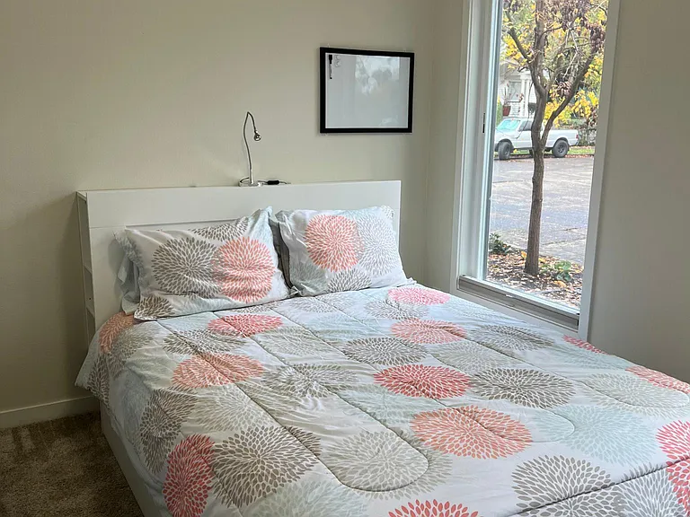 Guest bedroom with queen bed on first floor.