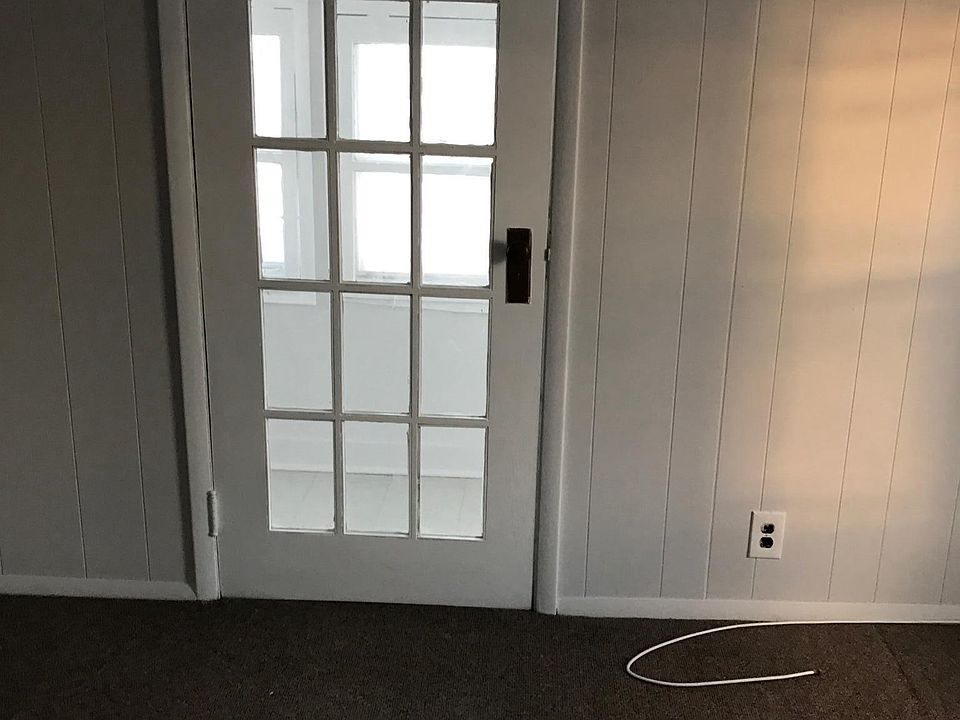 Door off of bedroom that leads to sun room