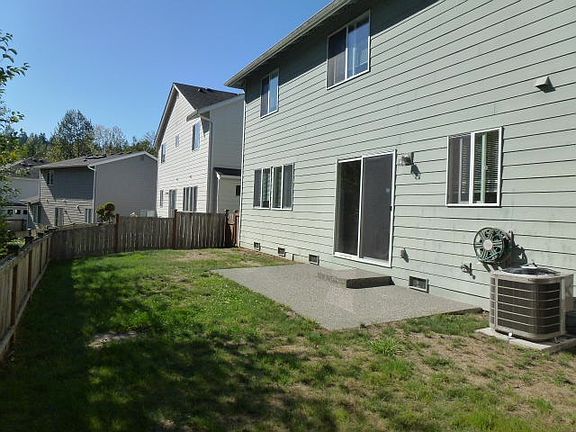Patio and grass in backyard