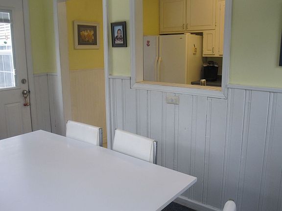 Sunny breakfast room with access to kitchen and deck