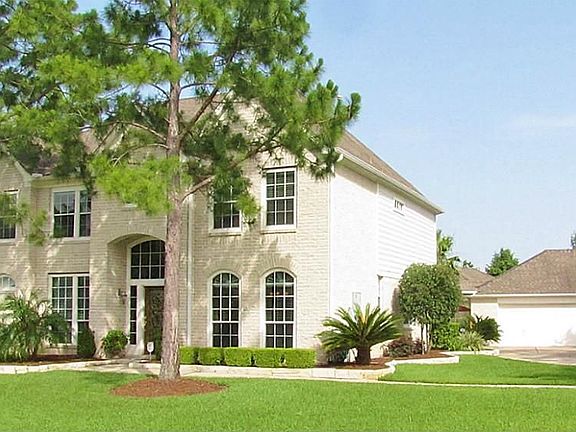 WIDE VIEW OF HOME SHOWING 3-CAR OVERSIZED GARAGE