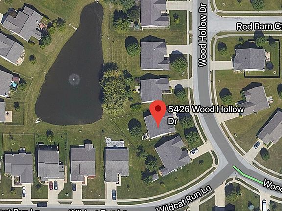 Aerial view of house w/pond