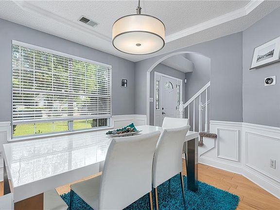 Updated lighting fixtures and wainscoting