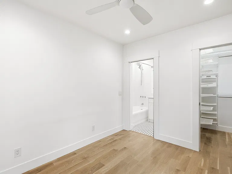View of the bedroom, closet, and bathroom entrance