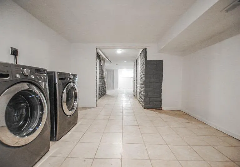 Head downstairs to the finished basement with washer and dryer
