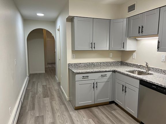 Hallway to front door, bedroom and living room